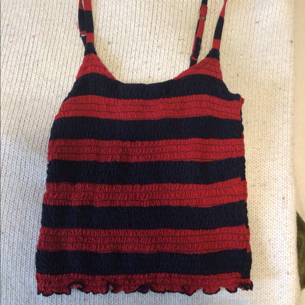A hole stern red and blue crop top.